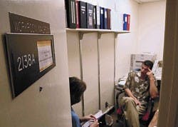 Ph.D. student Audrey Riffenburgh, left, talks with John Oetzel, communication and journalism chairman, during a meeting at his temporary office in Mesa Vista Hall on Wednesday.