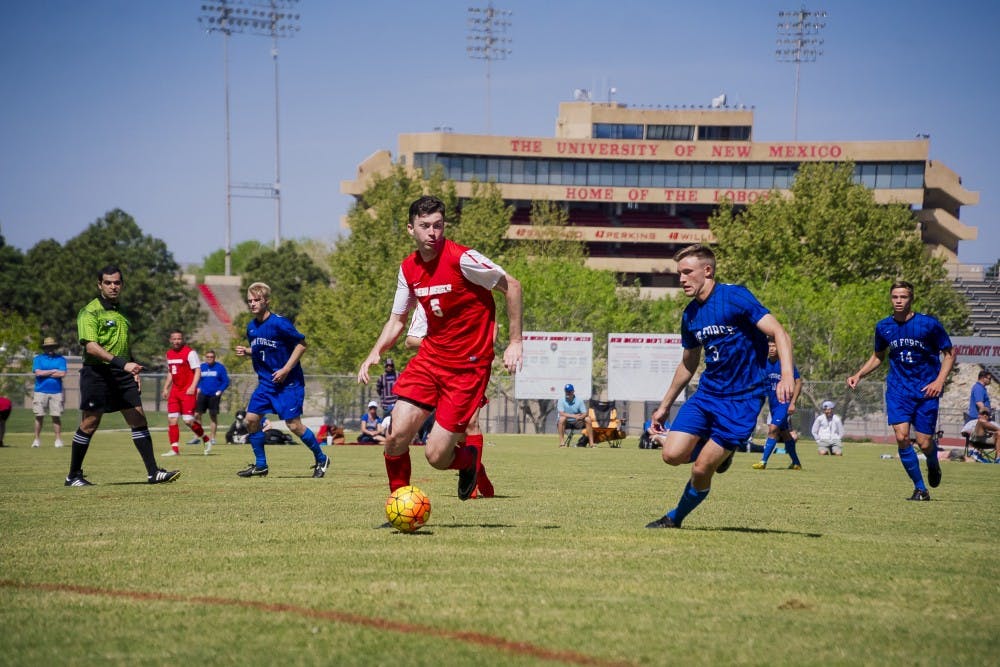 Midfielder Matt Dorsey (5) looks to move the ball across the fie