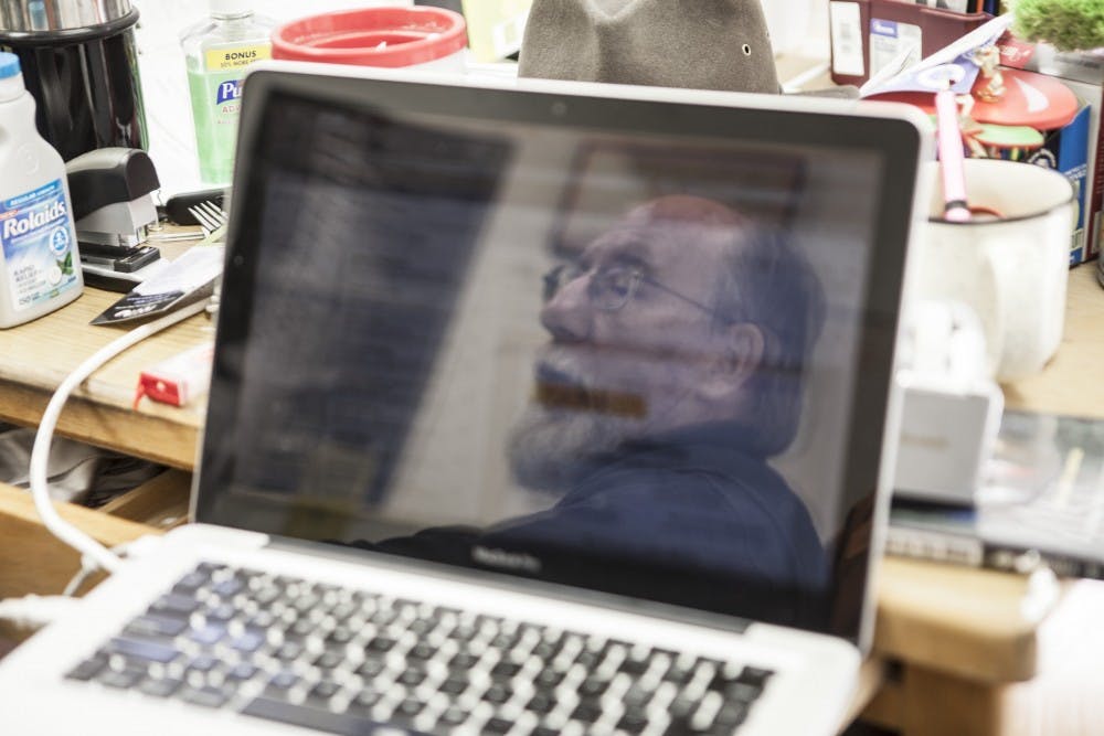 	Jim Burbank,  English lecturer and director of the English internship program, sits in his Humanities office on Feb. 26. Burbank is set to retire at the end of spring semester and said he believes his success from his years of teaching is measured in his students. 