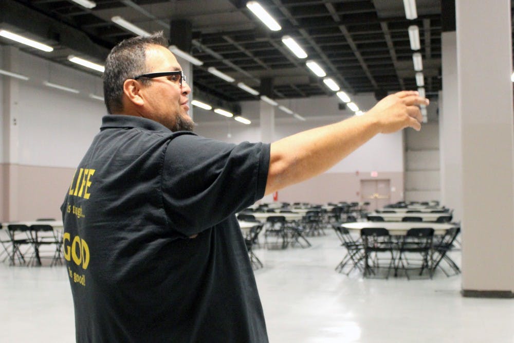 Dennis Billy, residence service manager at Joy Junction, discusses the setup for Thursday’s Thanksgiving meal on Tuesday afternoon. Joy Junction will serve 1,500 families at the convention center.