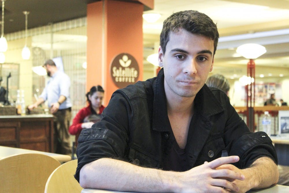 Annibal Reyes recounts his story about not being able to register for classes during the spring semester on Tuesday afternoon. Reyes is one of the 22 Venezuelan exchange students who are affected by the devastating economic climate in Venezuela. 