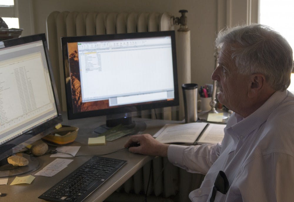 Dr. Esteban Muldavin catches up on work at his office in Marron Hall Thursday afternoon. Muldavin is the director of Natural Heritage New Mexico which is a division of the SouthWestern Biology Department. 