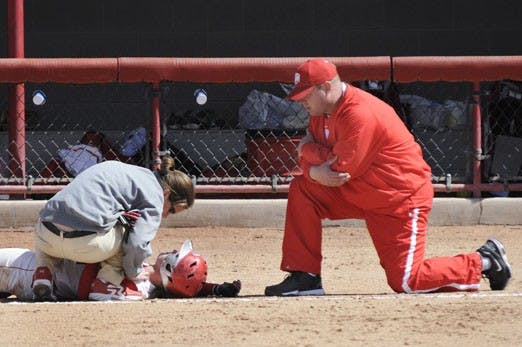 Head coach Ty Singleton, seen here tending to one of his players, had a daunting task this season. Singleton had to work with an inexperienced roster, but the Lobos will be better for it, Singleton said.