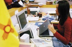 Stephanie Schwartz, an intern for Democratic Sen. Jeff Bingaman's campaign, helps out in the campaign headquarters on Montgomery Boulevard on Tuesday.