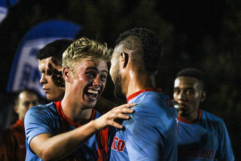 Redshirt freshman midfielder Devin Boyce, left, celebrates with senior forward Niko Hansen Friday September 2, 2016 at the UNM Soccer Complex. Boyce and Hansen scored the two goals that lead the Lobos 2-0 victory against CSU Northridge.&nbsp;