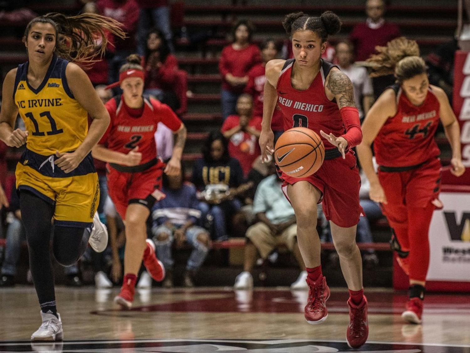Cherise Beynon (CQ) dribbles down the court during the Lobos second match-up of the UNM Thanksgiving Tournament, November 25, 2017. The Lobos defeated the Anteaters, 83-61, making the women 6-0 this season. 