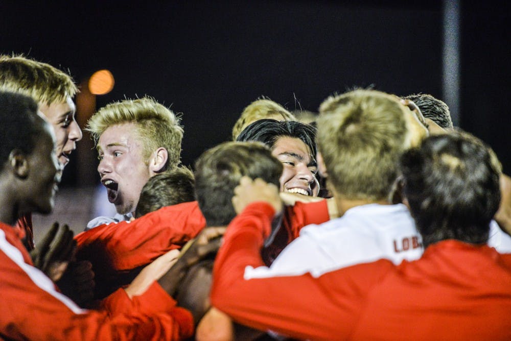 The Lobo bench rushes the field and erupts in excitement after Aaron Herreras goal in the second half on Tuesday, Oct. 4, 2016 at the UNM Soccer Complex. The Lobos beat LMU 3-0 on Tuesday night, improving to 7-3 on the season.