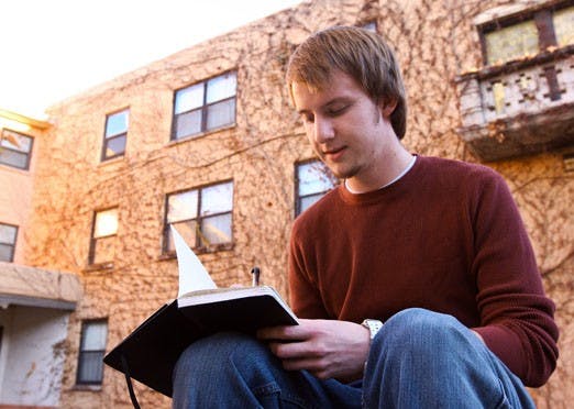 Freshman Micah Gjeltema, a Presidential Scholar, studies outside Hokona Hall on Wednesday. 