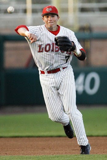 Shortstop Scott Gracey throws in Tuesday's game against NMSU at Isotopes Park. The Lobos lost Tuesday's game 15-2 but bounced back and defeated NMSU 13-1 on Wednesday.