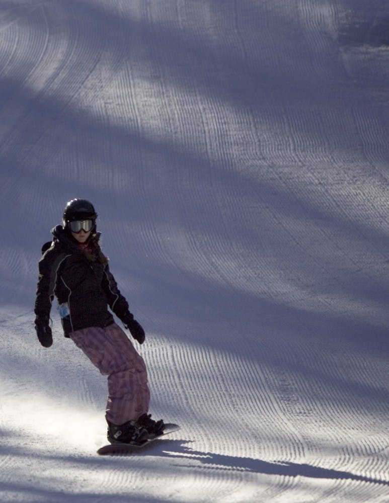 A woman boards down a slope in Santa Fe on Wednesday.