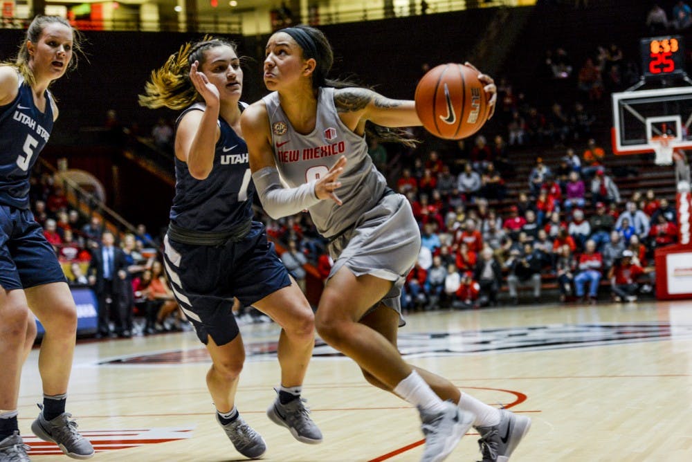 Junior guard Cherise Beynon looks up to the net as she drives the ball in Wednesday, Jan. 4, 2016 at WisePies Arena. The Lobos saw their first conference lost while on the road against UNLV ending their four game winning streak 56-42.