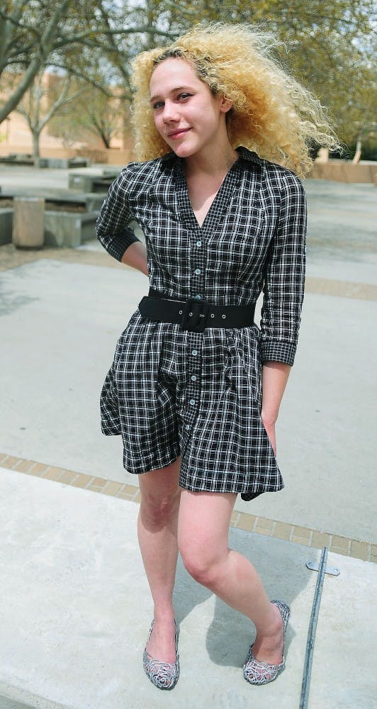 	Emily Linley
Tami Lynn
Studio Art, Junior
Dress: Anthropologie, $118
Belt: Goodwill, $2
Shoes: Aqui, $46
“Dressing is kind of making yourself into art for
the day.”
Sporting a look like something out of the ’80s is exactly what Emily is shooting for. She said she appreciates the fashion and culture of the time better than today’s because of its endearing quality. Accordingly, she teases her hair out, dyes it blond and occasionally styles loose sweaters with bright tights. She said that most of her clothing isn’t quite as expensive as her dress, but she splurges on something high class every now and then.