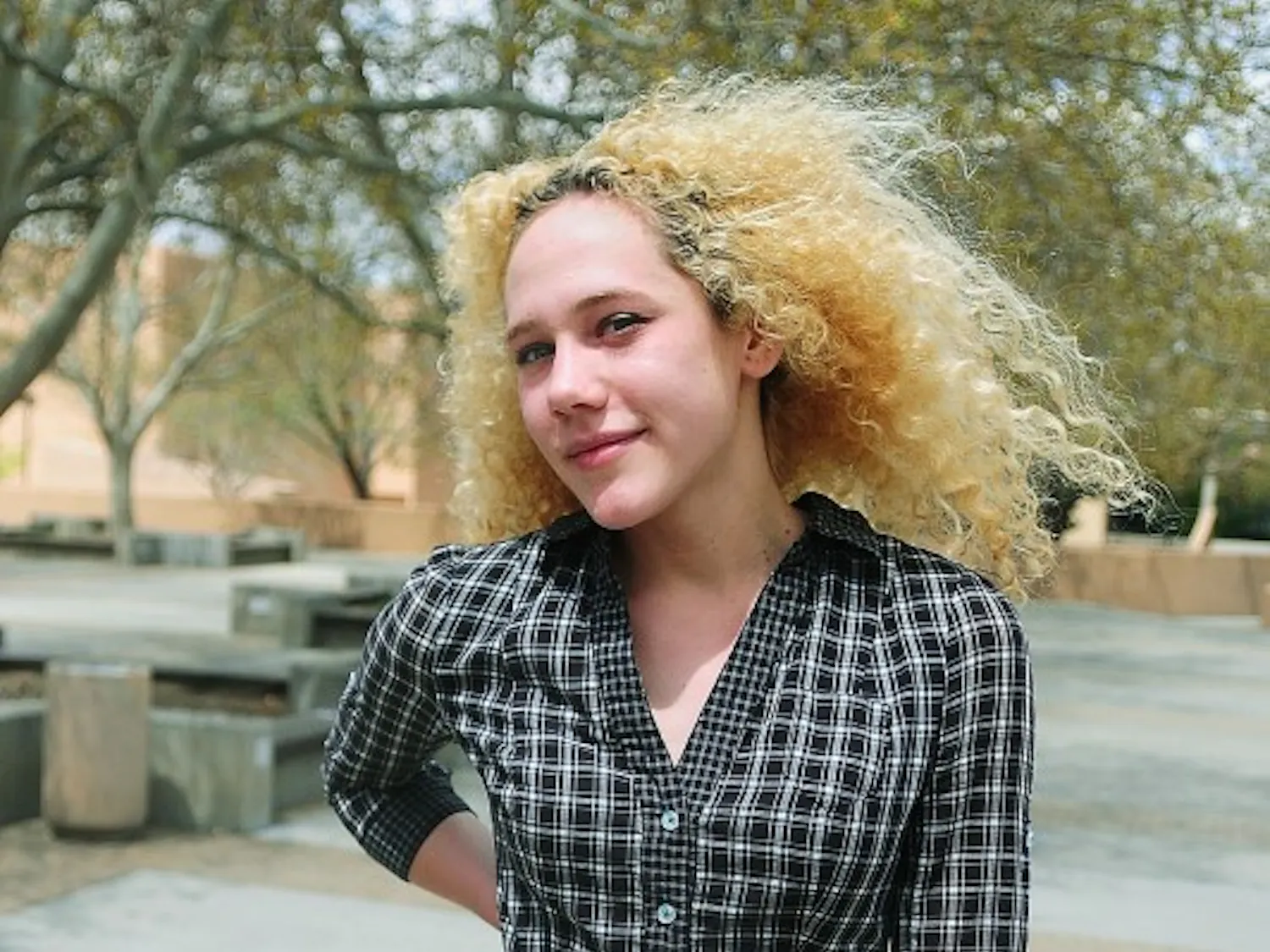 Emily Linley
Tami Lynn
Studio Art, Junior
Dress: Anthropologie, $118
Belt: Goodwill, $2
Shoes: Aqui, $46
“Dressing is kind of making yourself into art for
the day.”
Sporting a look like something out of the ’80s is exactly what Emily is shooting for. She said she appreciates the fashion and culture of the time better than today’s because of its endearing quality. Accordingly, she teases her hair out, dyes it blond and occasionally styles loose sweaters with bright tights. She said that most of her clothing isn’t quite as expensive as her dress, but she splurges on something high class every now and then.