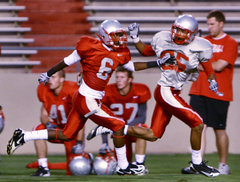 	Cornerback Anthony Hooks, left, runs stride for stride with wide receiver Quintell Solomon during an intrasquad scrimmage at University Stadium on Aug. 14. Hooks is competing for one of the Lobos’ vacated cornerback spots.