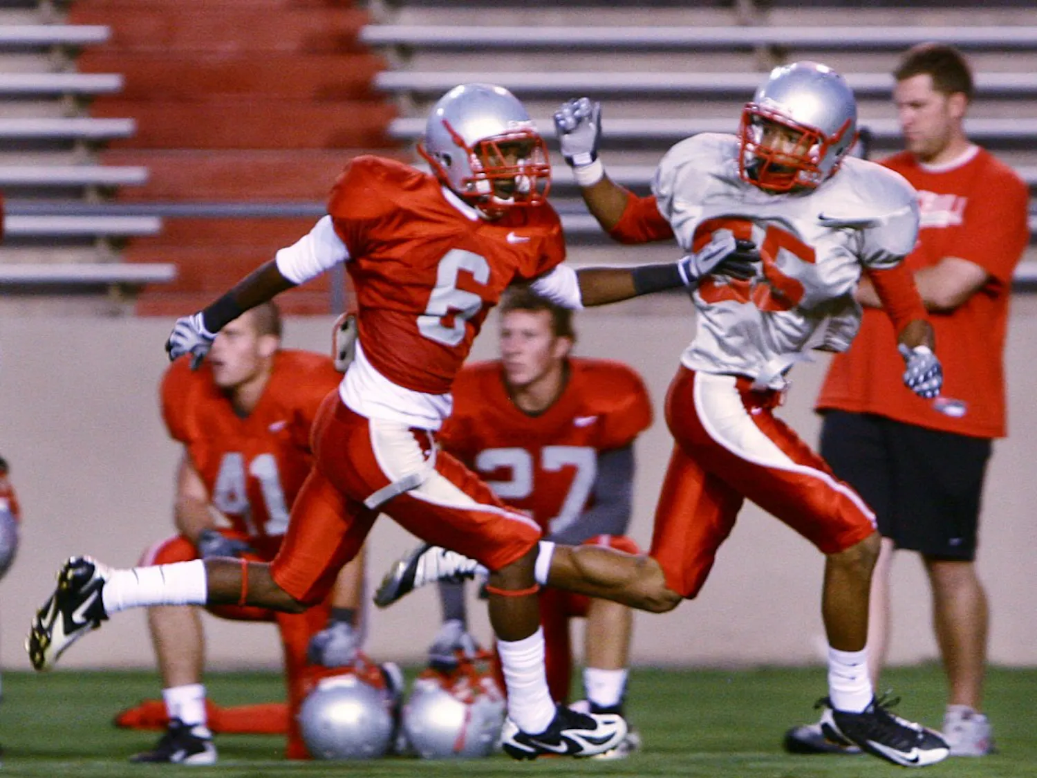 Cornerback Anthony Hooks, left, runs stride for stride with wide receiver Quintell Solomon during an intrasquad scrimmage at University Stadium on Aug. 14. Hooks is competing for one of the Lobos’ vacated cornerback spots.