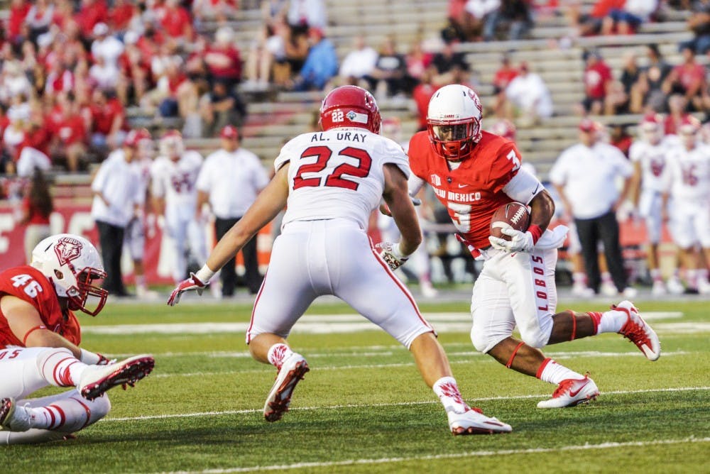 Junior running back Richard McQuarley dodges a line of South Dakota University defensemen on his way to the Lobo end zone on  Thursday, Sept. 1, 2016 at University Stadium. The Lobos will compete against San Jose State this Saturday to begin Mountain West play.