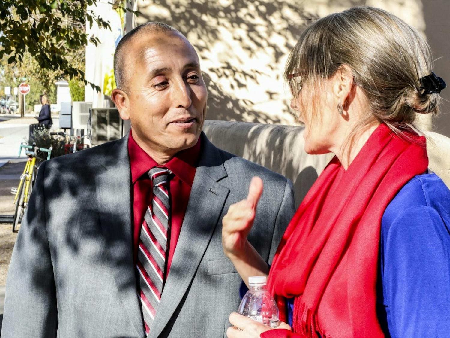 Student Veterans of UNM President Eliberto Calderon (left) and Senior Alumni Relations Officer Maria Wolfe talk during the grand opening of the Academic Affairs & Student Veterans building on Nov. 10, 2017. The facility is located on Buena Vista Dr. 