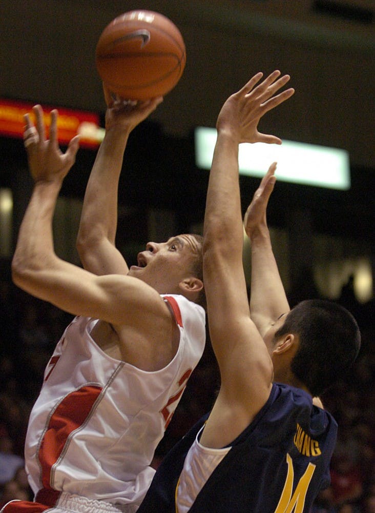 	Phillip McDonald shields the ball away from Cal’s Max Zhang during the Lobos’ 86-78 win Wednesday. The Lobos will try to remain perfect on Saturday, when they face New Mexico State at The Pit.