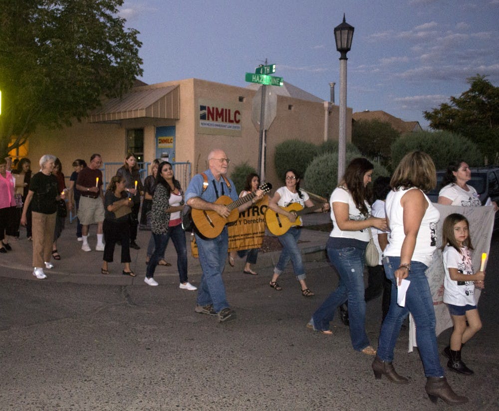 The Interfaith Vigil for Immigrant Justice and Dignity walks along 4th Street to support four Albuquerque women who are attending a 100-mile march.