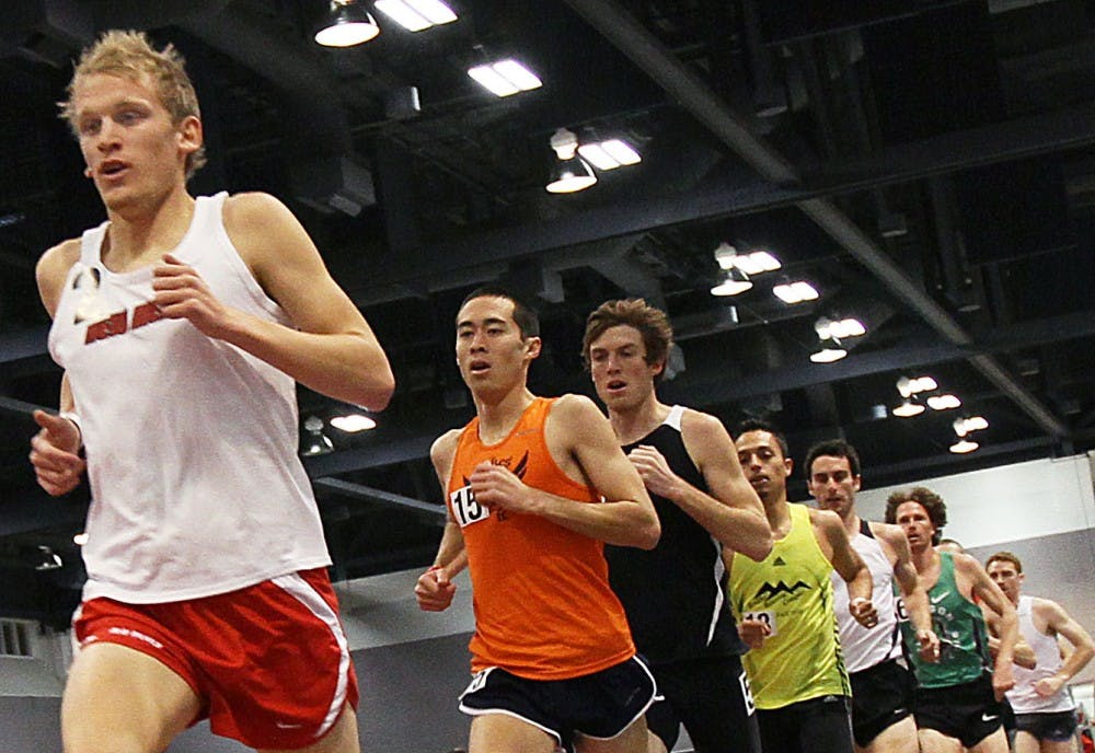 	Rory Fraser hovers in second place, while a pack of runners vie for position during the 3,000-meter run. Fraser closed quickly in the last 60 meters of the race and won Saturday at the Albuquerque Convention Center. 