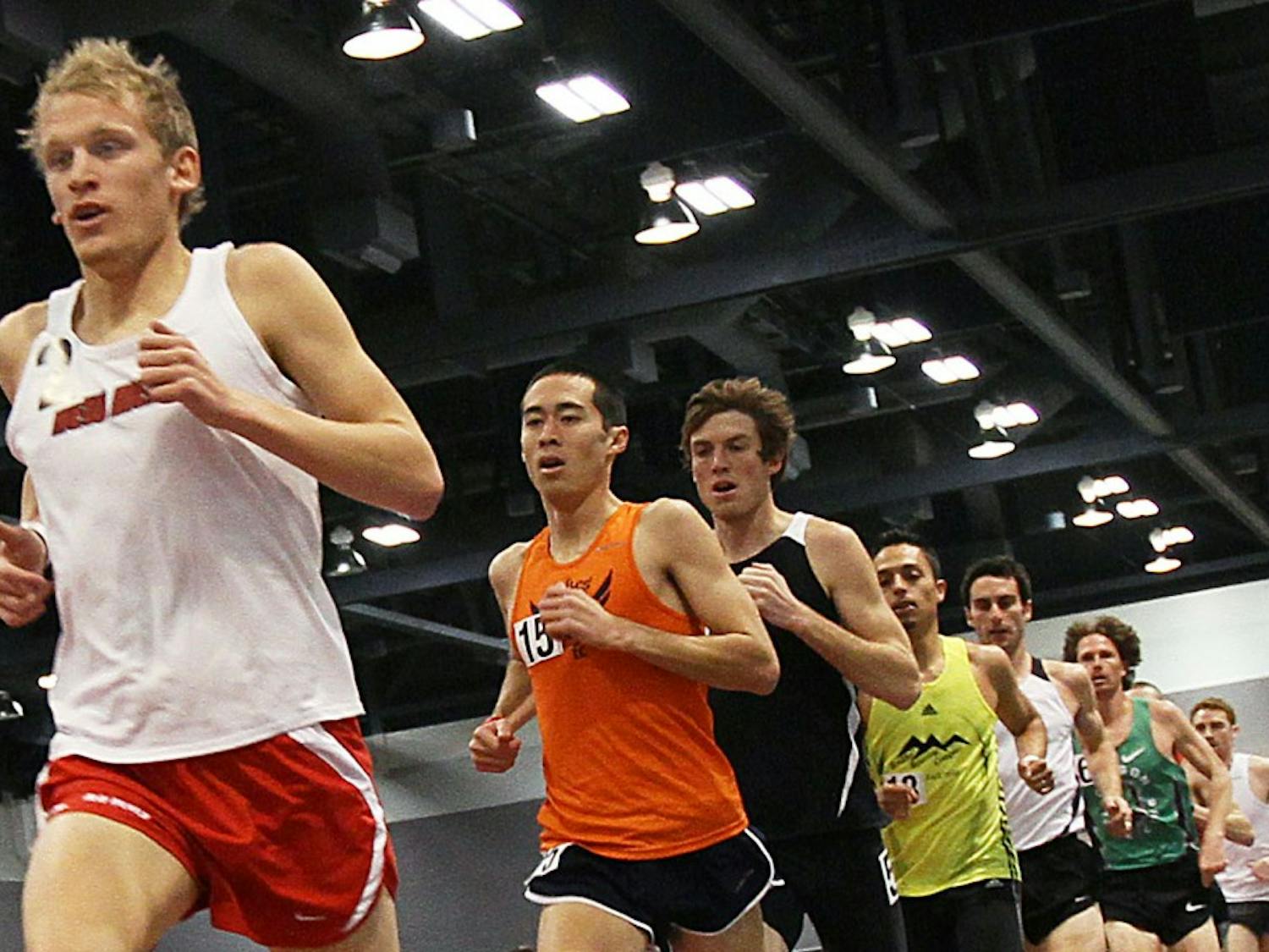 	Rory Fraser hovers in second place, while a pack of runners vie for position during the 3,000-meter run. Fraser closed quickly in the last 60 meters of the race and won Saturday at the Albuquerque Convention Center. 