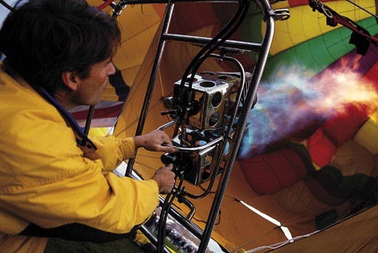 Pilot Kevin Flanagan prepares his balloon, Debbie's Dream, for flight before the mass ascension Saturday at the Albuquerque Balloon Fiesta Park.
