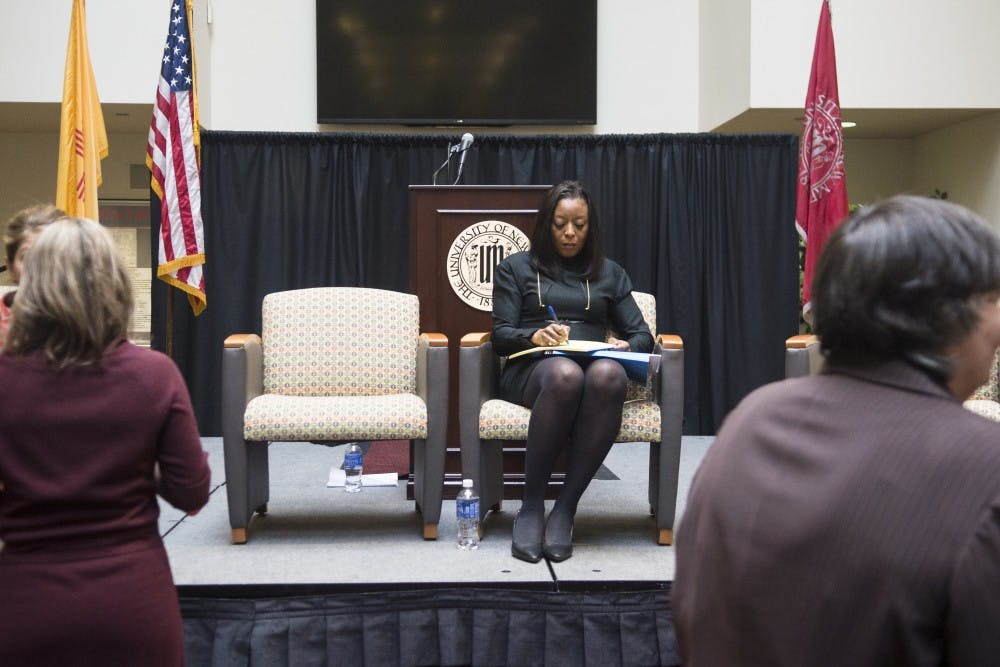 Jill Pilgrim, owner and founder of Pilgrim & Associates, jots down onto her notes at the sexual assault panel inside the SUB Atrium on Thursday. Pilgrim presented her teams final report during the panel concerning UNMs handling of previous sexual assault cases on campus.