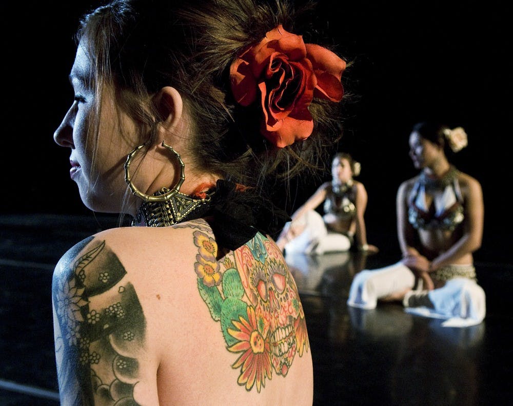 	Leah Harrison takes a break during a rehearsal for “Bakkheian” on Tuesday at Carlisle Gym. The dance is part of “Leverage,” UNM’s choreography student showcase.
