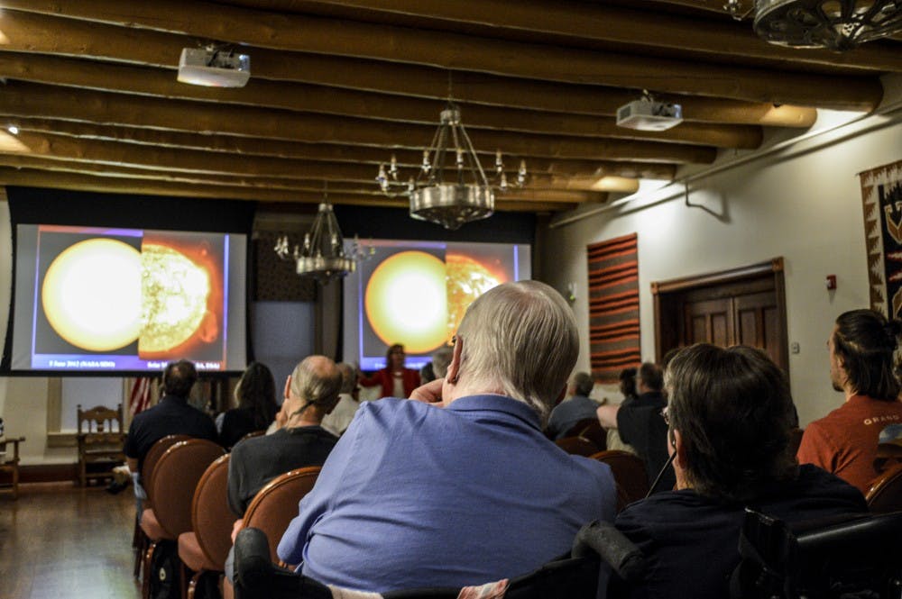 Community members listen to a lecture titled “Our Abundant Universe,” presented by the New Mexico Philharmonic Music and Arts Festival on April, 24, 2018.