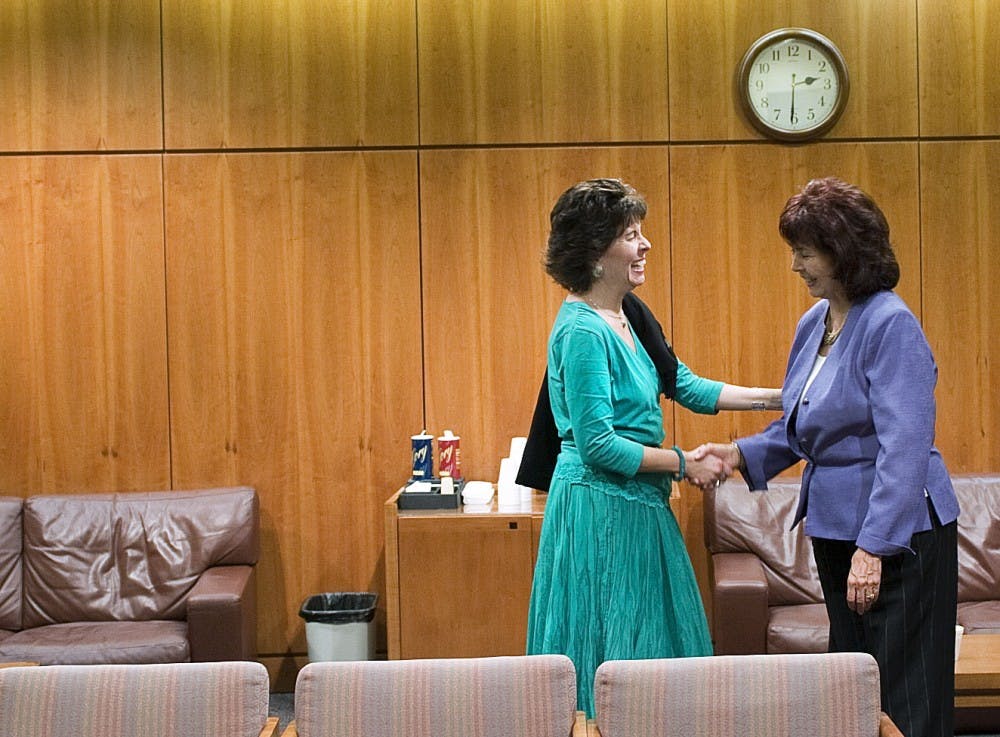 	Senators Linda Lopez (D-Bernalillo-11), left, and Lynda Lovejoy (D-Bernalillo, Cibola, McKinley, Rio Arriba and Sandoval-22) greet each other in the Senate Lounge. Monday was the first day of the special session of the New Mexico Legislature, which aims to address the state’s estimated $600 million budget deficit.
