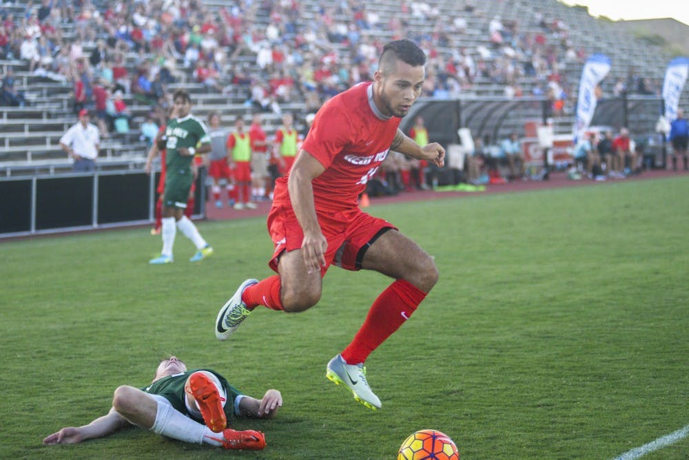 Senior forward Niko Hansen leaps over a fallen Cal Poly player on his way to the net on Sunday, Sept. 4, 2016 at the UNM Soccer Complex. The Lobos defeated UC Irvine 3-1 on Saturday.