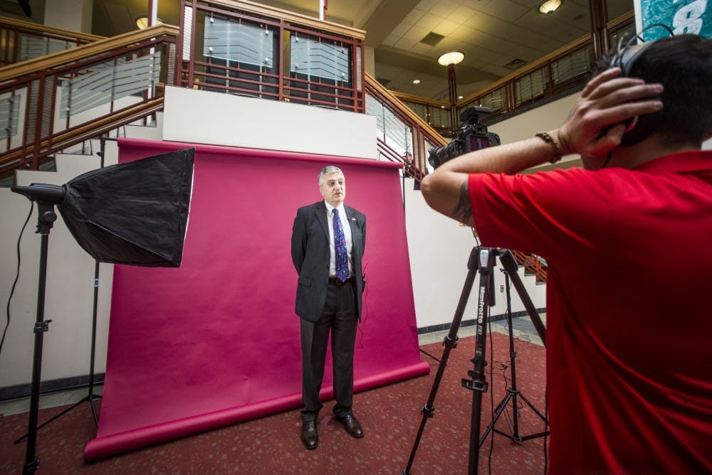 Acting University President Chaouki Abdallah speaks in front of a camera as part of a project to promote international students on Wednesday, Feb. 8, 2017 in the UNM SUB Atrium.