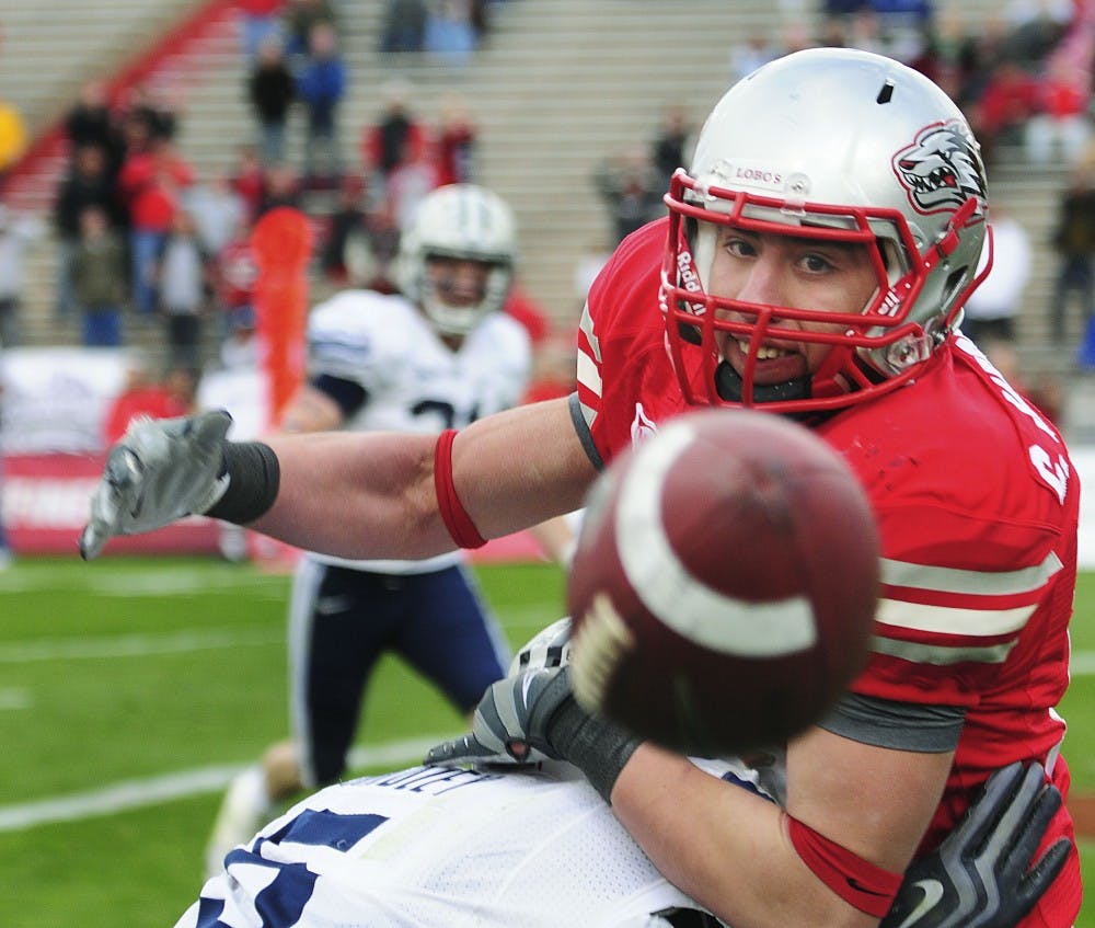 	Wide receiver Chris Hernandez battles for position with BYU cornerback Brandon Bradley. The Lobos came up short at University Stadium on Saturday, 24-19.