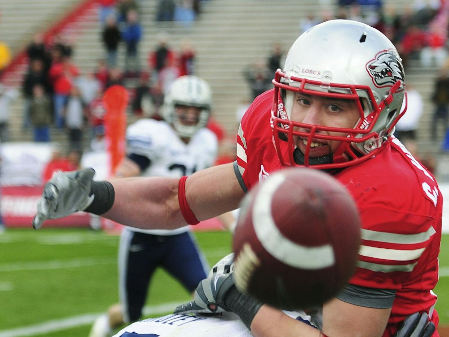 Wide receiver Chris Hernandez battles for position with BYU cornerback Brandon Bradley. The Lobos came up short at University Stadium on Saturday, 24-19.