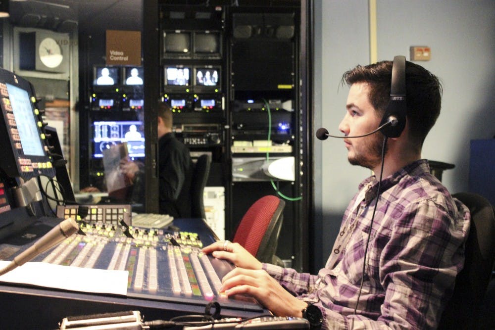 Anthony Rodrigues works production for KNME television program Public Space on Wednesday morning. Rodrigues is just one of many UNM students who intern with KNME to gain experience and develop news and media skills.