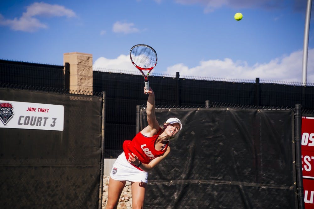 Dominique Dulski serves the ball against the Unviersity of Minnesota on Mar 12th 