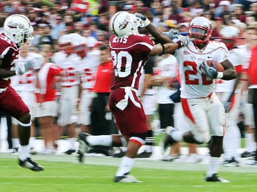 Lobo tailback Paul Baker carried the ball 37 times for 146 yards and a touchdown during Saturday's 35-24 win at Aggie Memorial Stadium in Las Cruces. 