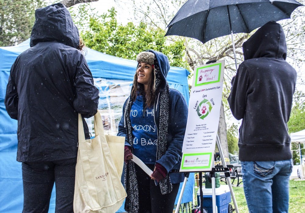 Sherilyn Latimer, center, and Dana Sharp, right, talk to an attendee at the Growers Market in downtown Albuquerque on Saturday morning. The two are students in the Sustainability Studies program and were talking to people about the upcoming Sustainability Expo on Thursday.