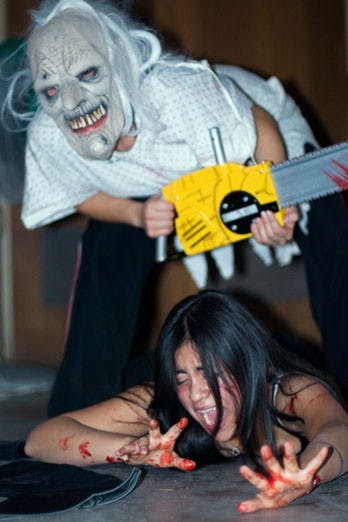 Stephanie Alvarado, standing, and Julianne Flores at the Haunted Basement in Mesa Vista Hall. The Haunted Basement is hosted by El Centro de la Raza to support the Ida Romero Memorial Scholarship and will be open through Halloween. 