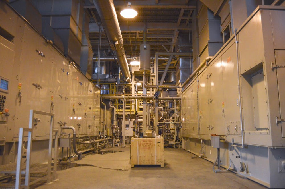 Solar turbines, known as cogeneration machines, run inside the Ford Utility Center on Wednesday morning. These turbines provide power for much of the UNM area.