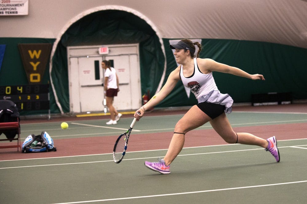 Freshman Ruth Copas runs to return the ball Friday, Feb. 12, 2016 at the Linda Estes Tennis Center. The Lobos will play Utah this Saturday at 5 p.m.