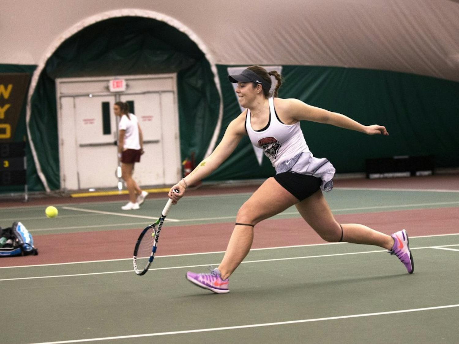 Freshman Ruth Copas runs to return the ball Friday, Feb. 12, 2016 at the Linda Estes Tennis Center. The Lobos will play Utah this Saturday at 5 p.m.