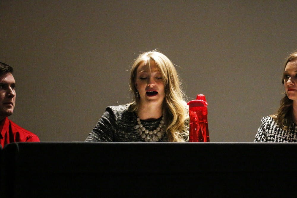 ASUNM Sen. Justin Cooper (left) and President&nbsp;Jenna Hagengruber (right) listen to Chief of Staff&nbsp;Tori Pryor as she speaks during the town hall as part of&nbsp;ASUNM’s first ever State of ASUNM Address. The address and town hall&nbsp;touched on the lottery scholarships, ongoing safety initiatives and how better to engage the student body.