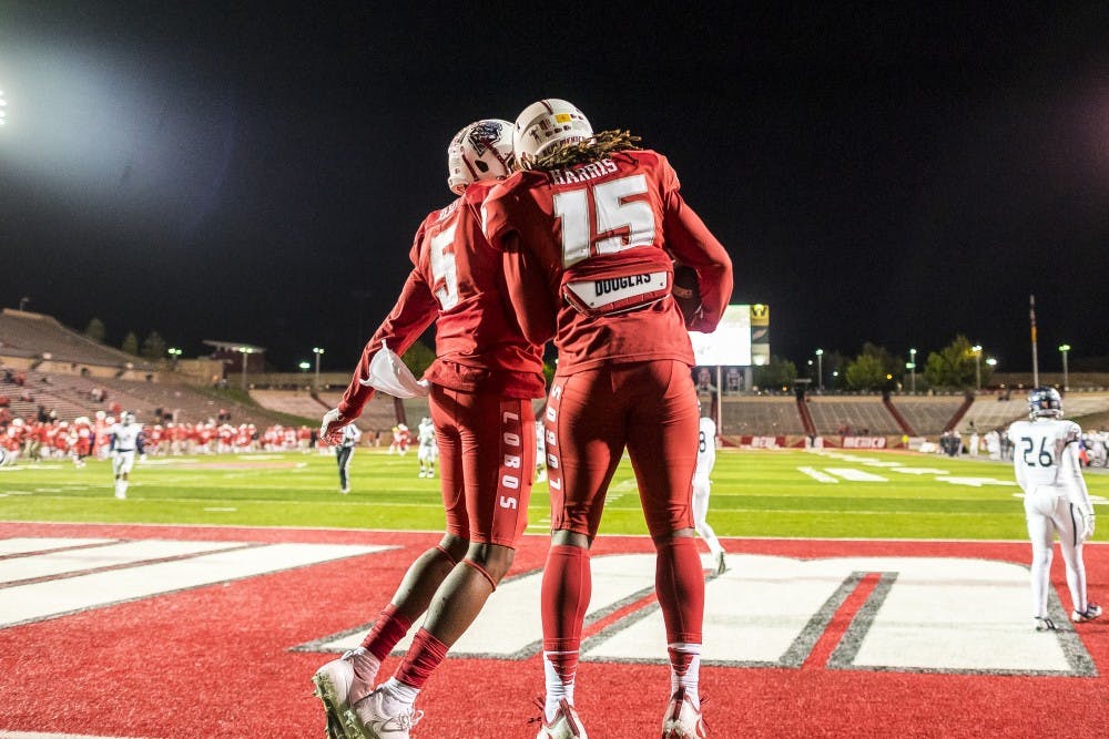 Wide Reciever Emmanuel Harris (15) celebrates a 2nd half touchdown with Oatrick Reed (5) against the Nevada Wolfpack at Branch Field at University Stadium early Sunday morning 
