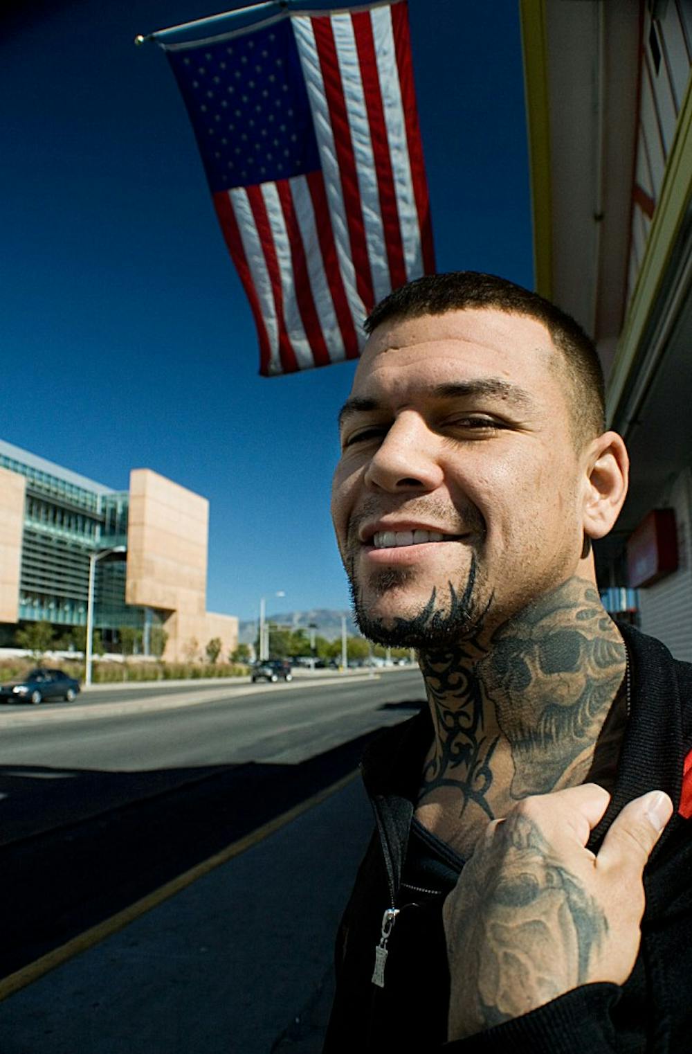 	Professional Mixed Martial Arts fighter Gerald Lovato shows off his tattoos in front of the Frontier on Monday.