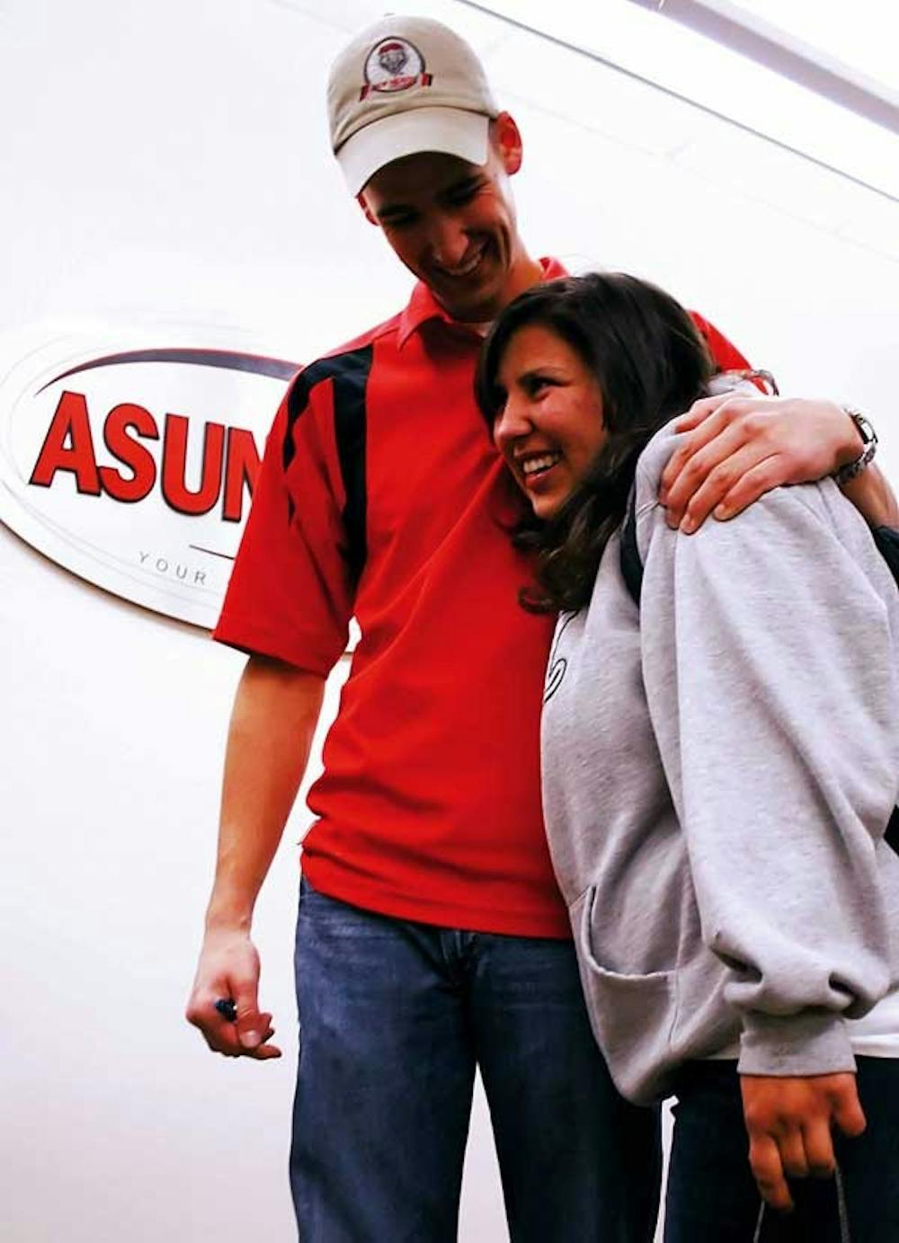 Christina Lovato hugs ASUNM Vice President Matt Barnes after finding out she was re-elected to the Senate on Wednesday in the SUB. 