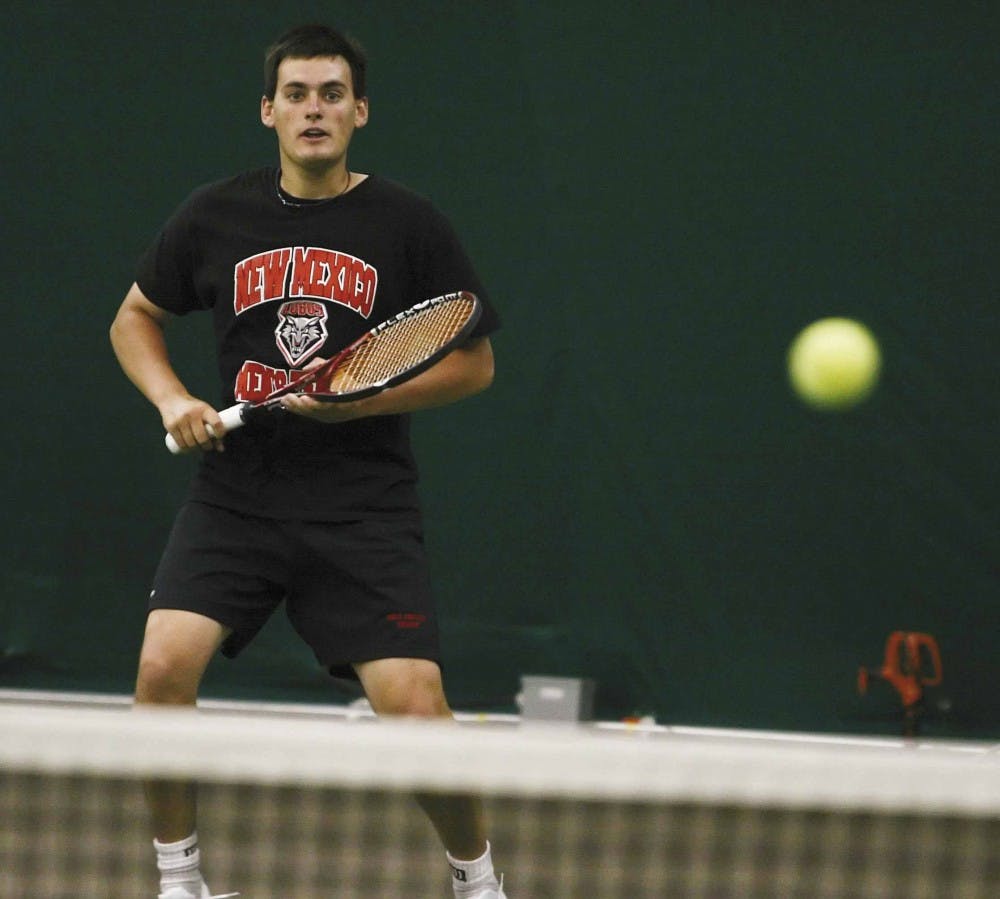 Chris Parkes watches the ball cross the net during Thursday's practice at the UNM  Tennis Complex. 