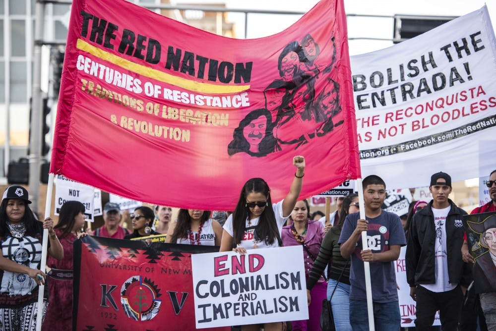 KIVA Club members march with demonstrators during an Indigenous Peoples’ March Monday, Oct. 10, 2016. KIVA is a student organization based out of UNM that educates and encourages students and community members on Native American issues.