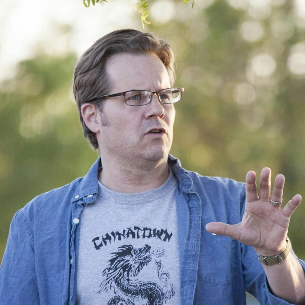 	UNM professor David Correia speaks at a vigil for APD shooting victim Armand Martin on May 4. Charges against Correia, stemming from his arrest on June 2, for allegedly assaulting a police officer during a nonviolent sit-in at the office of Mayor Richard Berry, were dropped.