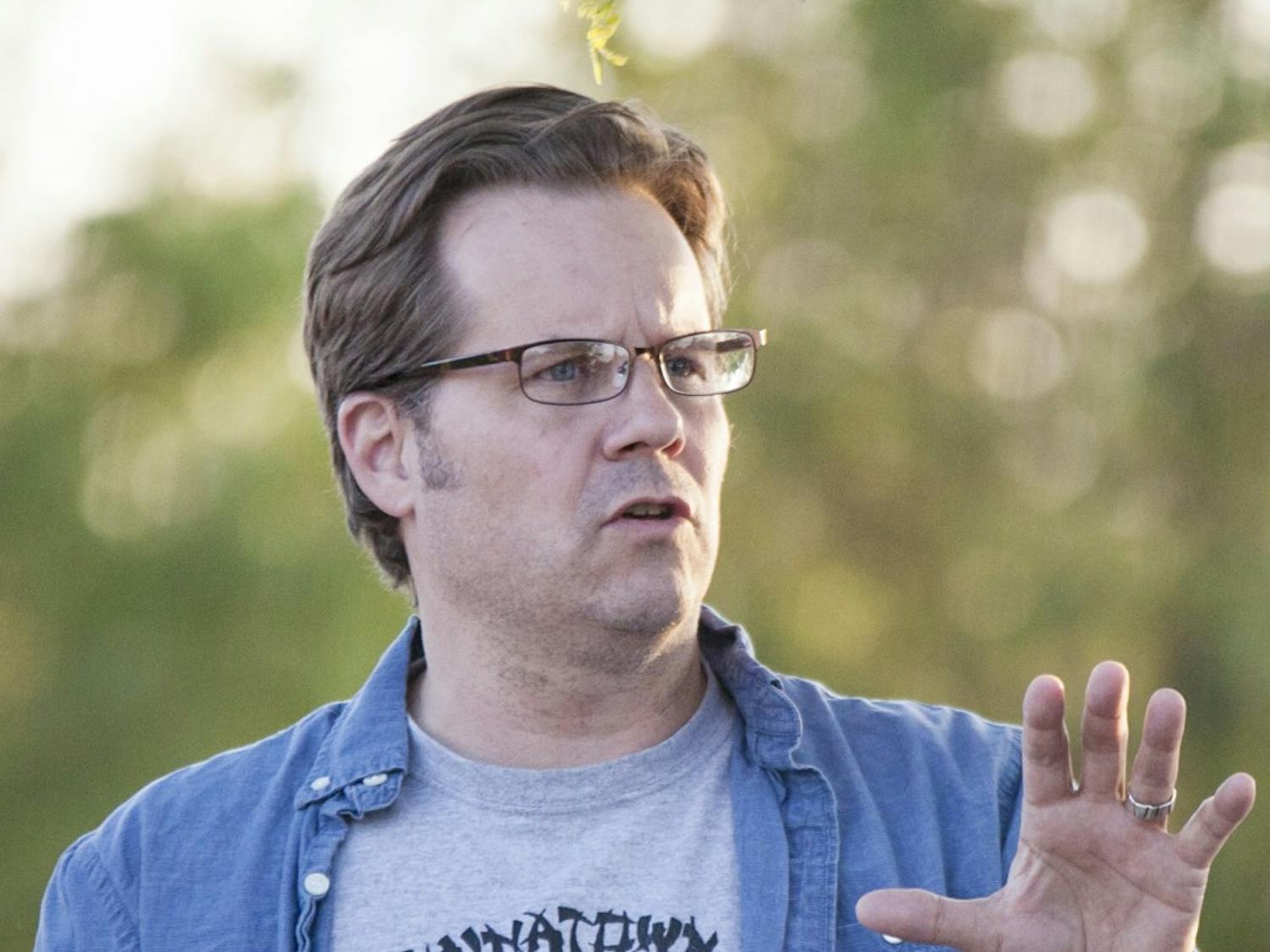 UNM professor David Correia speaks at a vigil for APD shooting victim Armand Martin on May 4. Charges against Correia, stemming from his arrest on June 2, for allegedly assaulting a police officer during a nonviolent sit-in at the office of Mayor Richard Berry, were dropped.